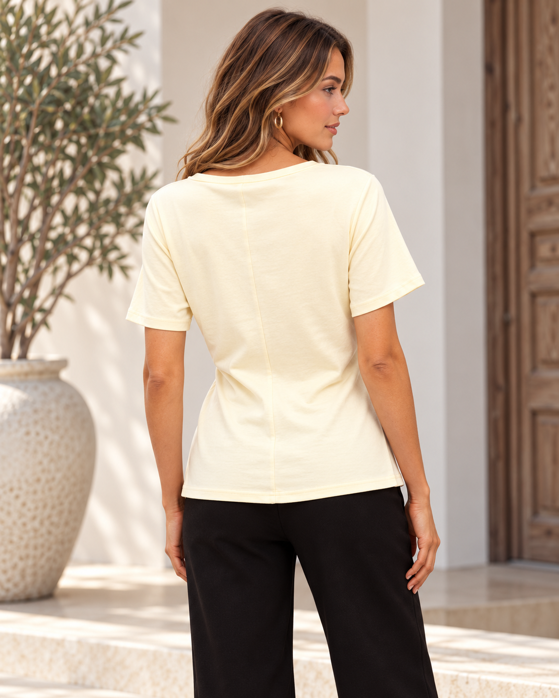 Back view of the Mood Tee in butter yellow showing the relaxed fit