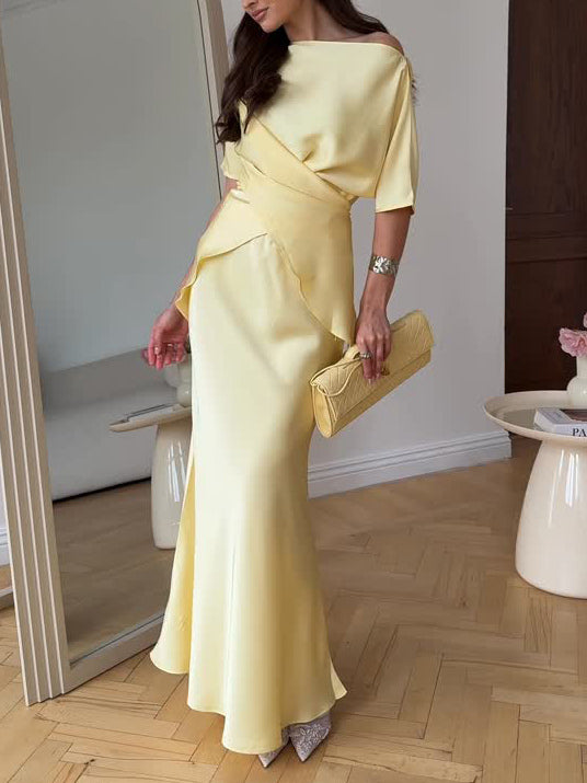pale yellow off shoulder wrap style top with matching maxi satin skirt