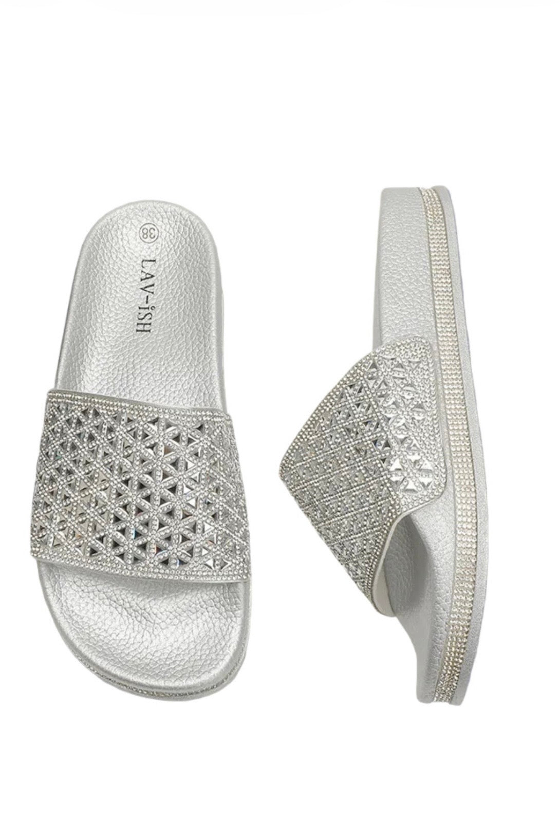 A pair of silver slide sandals embellished with rhinestones, shown from the top and side views on a plain white background. The brand name 'LAV-ISH' is printed on the footbed of the left sandal.