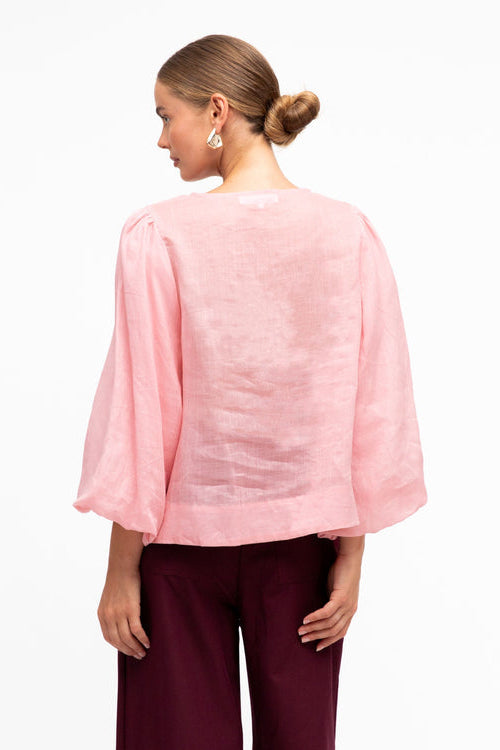 white closet pink blouse