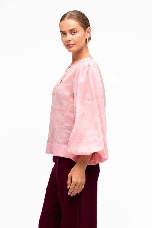 white closet pink blouse