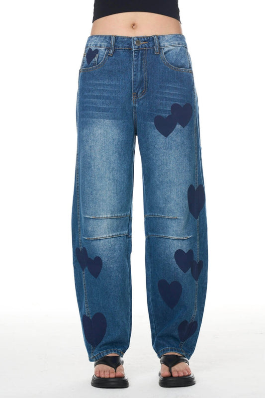 Blue jeans with heart patterns on a white background