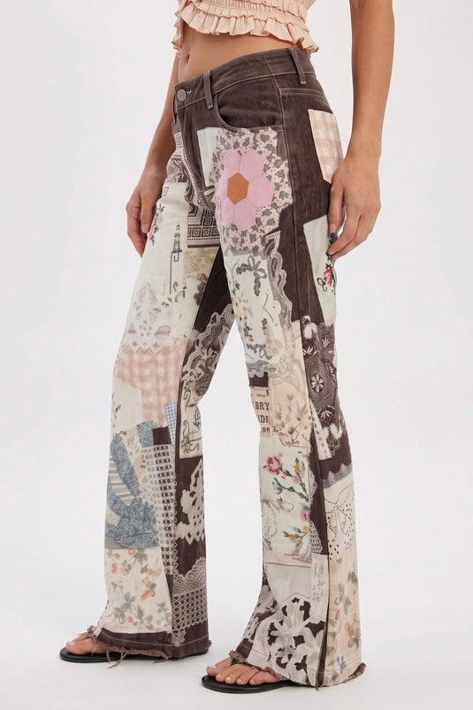 A close-up side view of the Parise Patch Jean featuring a patchwork print in brown, cream, pink and blue tones with a flare leg silhouette, styled with a blush crop top.