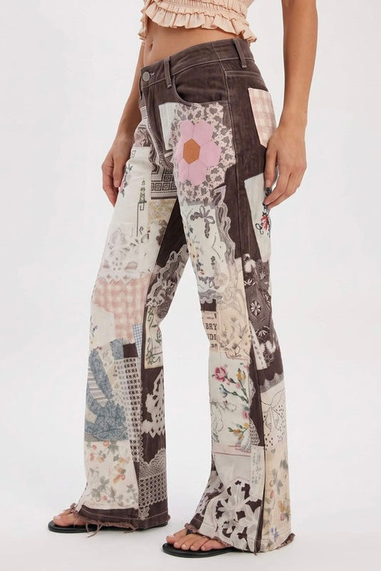 A close-up side view of the Parise Patch Jean featuring a patchwork print in brown, cream, pink and blue tones with a flare leg silhouette, styled with a blush crop top.