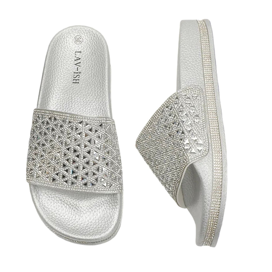 A pair of silver slide sandals embellished with rhinestones, shown from both the top and side views on a white background. The brand name 'LAY-ISH' is visible on the footbed of the left sandal.