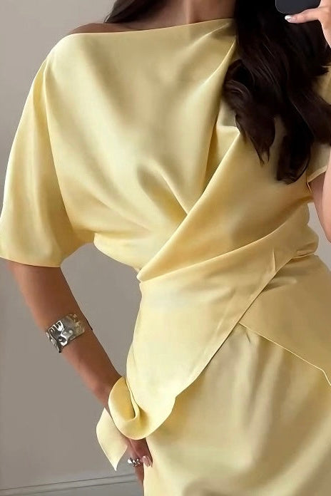 Yellow off-shoulder warp style top with matching skirt
