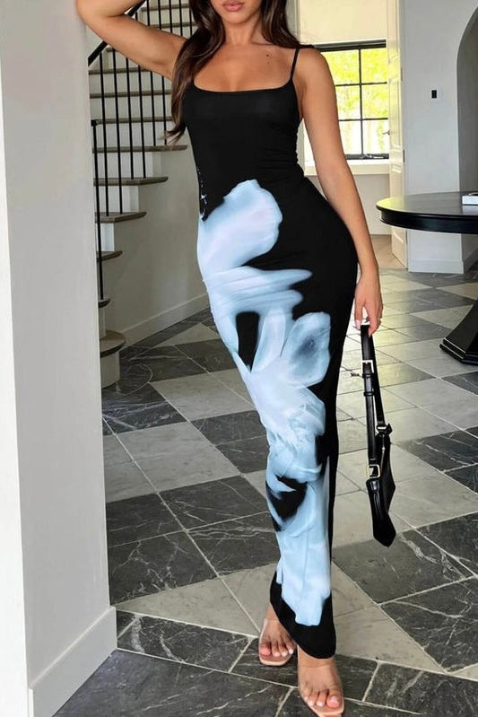 Woman in a black and white dress and flower print down one side
