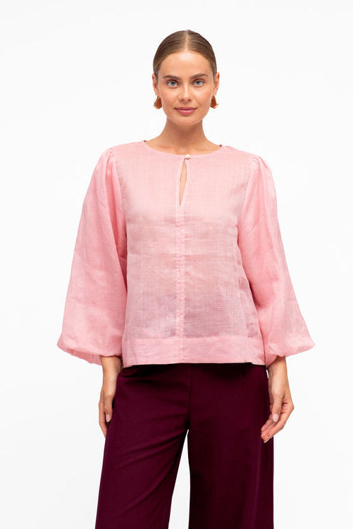 white closet pink blouse
